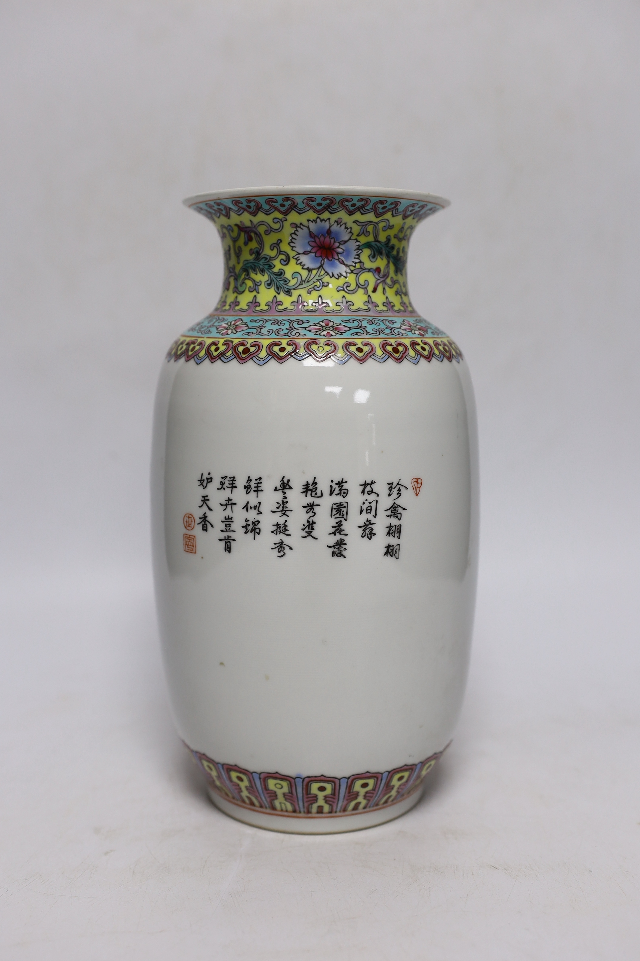 A Chinese famille rose vase, two Japanese blue and white rice bowls and covers and a Japanese blue and white vase (4) tallest 24.5cm